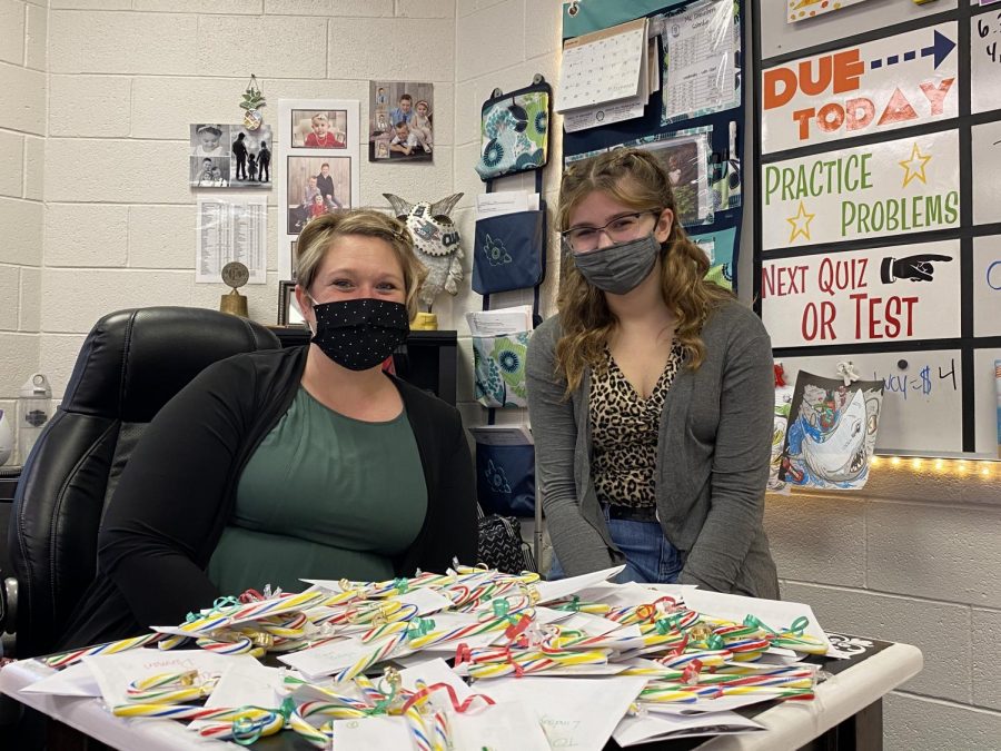 Key Club adviser Tara Chesebro and Key Club President Lindsay Mularski organize Candy Cane Grams for delivery. The club bought the candy canes from Clay Lamberton to support the elementary schools fundraiser.