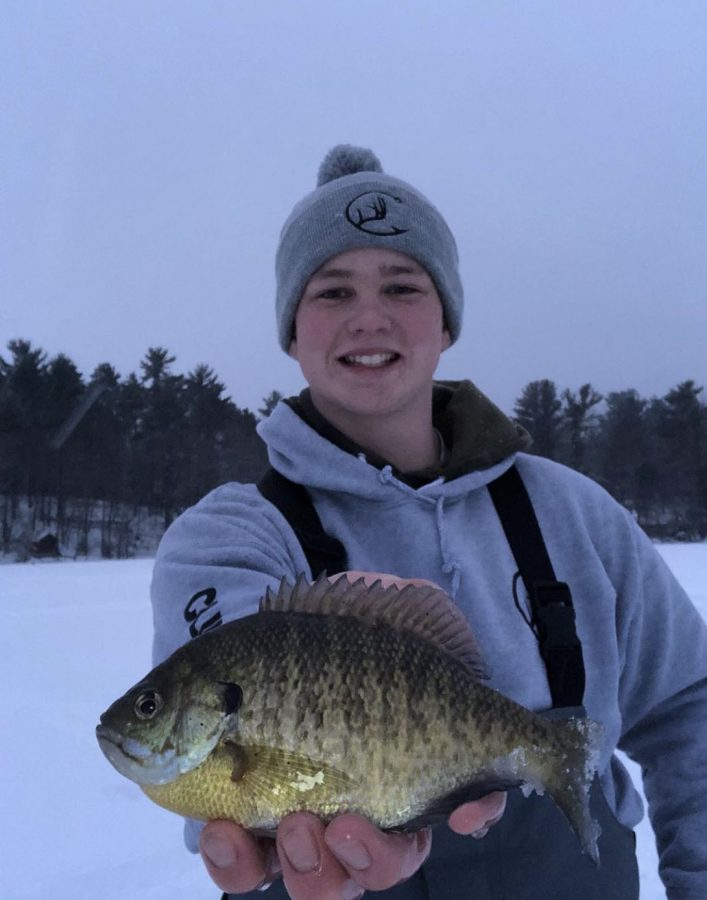 Junior Jaron Clinch goes ice fishing after school and catches a bluegill. Clinch started a new series on “Clinch Outdoors” about him after school fishing. “It’s very tough to stand out when someone else is always doing what you’re doing. However, I love making videos which is what truly matters,” Clinch said.