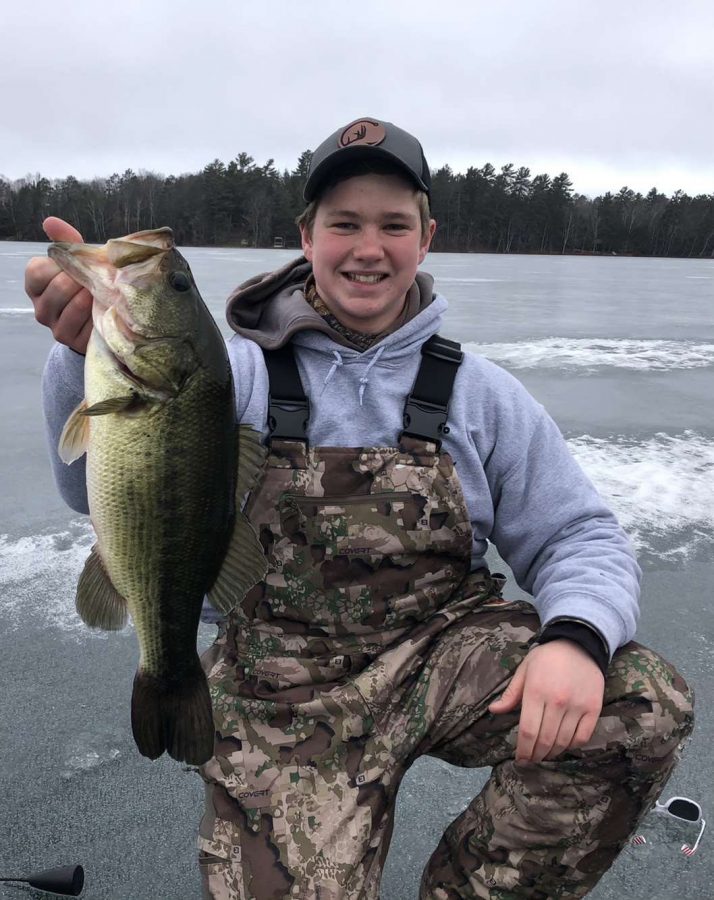 Junior+Jaron+Clinch+reeling+in+a+largemouth+bass.+He+was+wearing+a+Clinch+Outdoors+sweatshirt+and+hat.+%E2%80%9CNot+only+in+school+do+people+talk+about+Clinch+Outdoors%2C+but+outside+of+school+there+are+tons+of+adults+who+enjoy+the+videos+and+brand+itself%2C%E2%80%9D+Clinch+said.