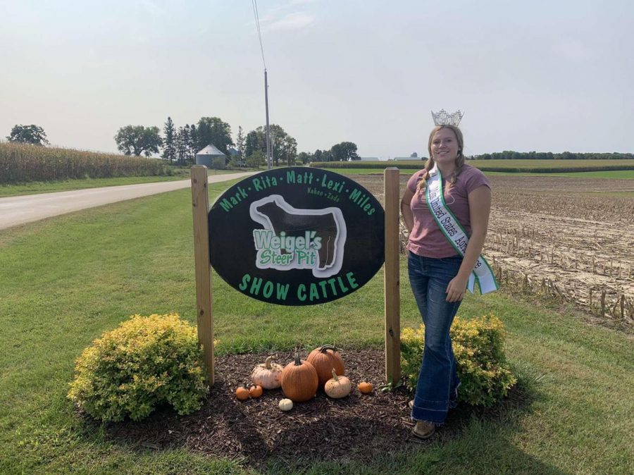 Senior Sadie Goettl has held the Central Wisconsin Miss United States patent title since 2020. Some of Goettls duties consist of visiting farms, doing community service, and teaching about agriculture in school. Shown above, Goettl handed out awards at the Waupaca County Youth Livestock Expo. 