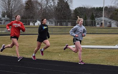 Distance runners senior Mariah Wagner, senior Nya Osterberg, and sophomore Anna Kurczeck, running the track doing buildup ladders working on finishing strong. “We hope to get the runners a base in order to be somewhat in shape as the season officially starts,” Head coach Matt Willett said. 
