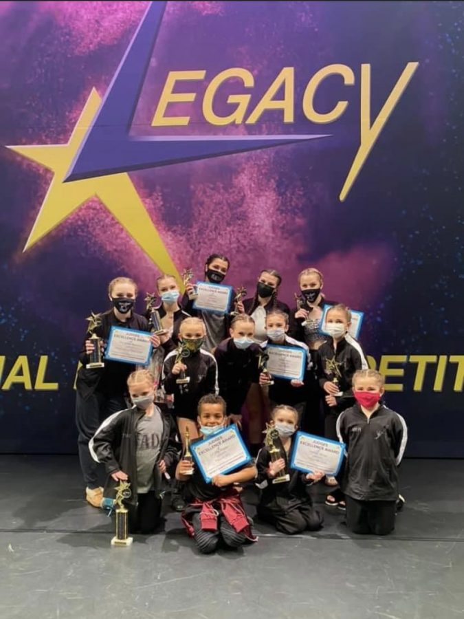The+Studio+A+Dance+Academy+mini+team+and+senior+team+each+received+medals+after+the+senior+team+placed+first+with+their+lyrical+dance%2C+%E2%80%9CStill%2C%E2%80%9D+and+fifth+place+with+their+jazz+dance%2C+%E2%80%9CEverything+that+I%E2%80%99ve+Got.%E2%80%9D+The+mini+team+jazz+danced+to%2C+%E2%80%9CCalifornia+Girls%2C%E2%80%9D+receiving+third+place+and+their+lyrical+dance%2C+%E2%80%9CSmile%2C%E2%80%9D+receiving+second+place.+%E2%80%9COur+team+did+a+good+job+staying+in+sync+and+using+facials%2C%E2%80%9D+sophomore+Emilee+Wegner+said.%0A%0A