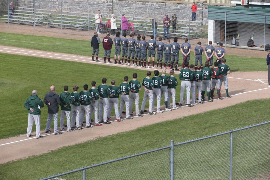 The Berlin Indians and Omro Foxes line up for the national anthem on the May 10 matchup.