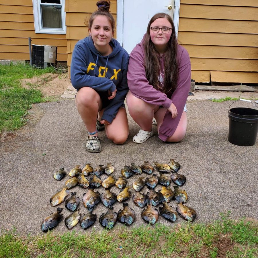 Seniors Samantha Henriksen and Molly Stadler go fishing up north during a trip they took last summer. “The main reason our friendship has lasted so long is because we never get into fights. Weve had a few arguments, but those are minor because we always work it out,” Henriksen said. 
