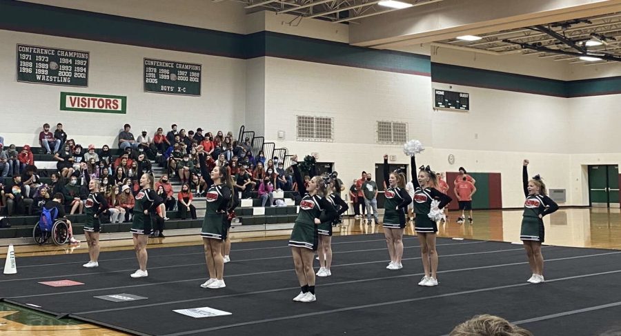 Cheer team performs new routine for Homecoming pep assembly.  The cheer team only had four practices to prepare for their performance.  
