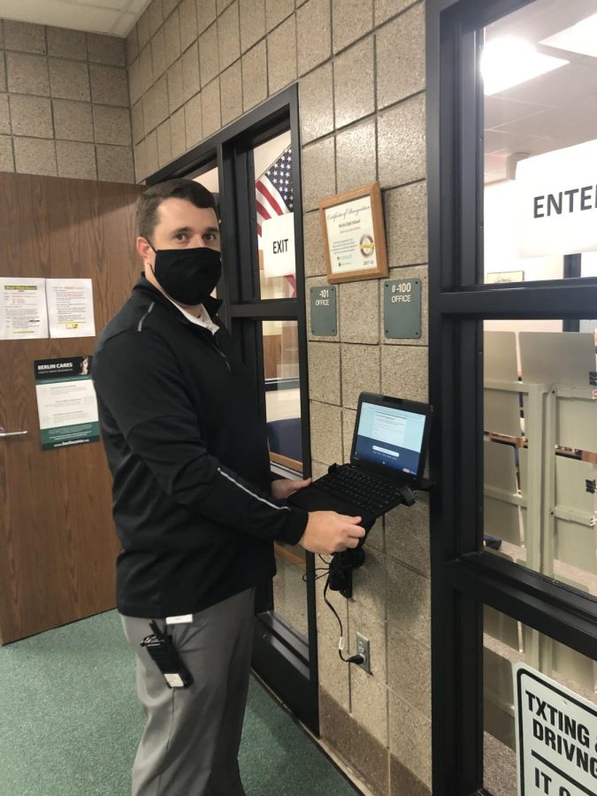 Principal Bryant Bednarek sets up the Chromebook students will be required to use to sign in if they have had their open campus revoked.