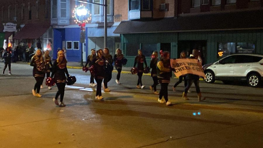BHS cheer team walks in the Holiday Parade on Nov. 18.