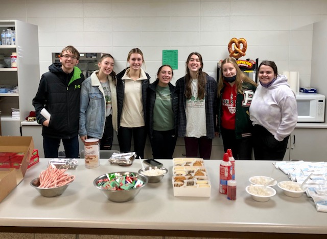 KIND Committee members run hot chocolate stand to show appreciation for teachers.