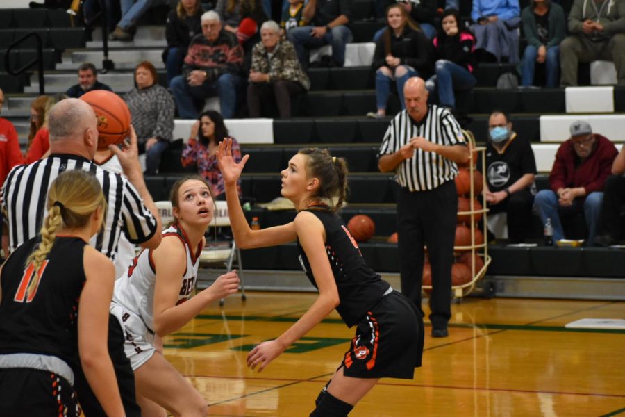 Sophomore Claire Bartol goes for the tip off against Plymouth High School.