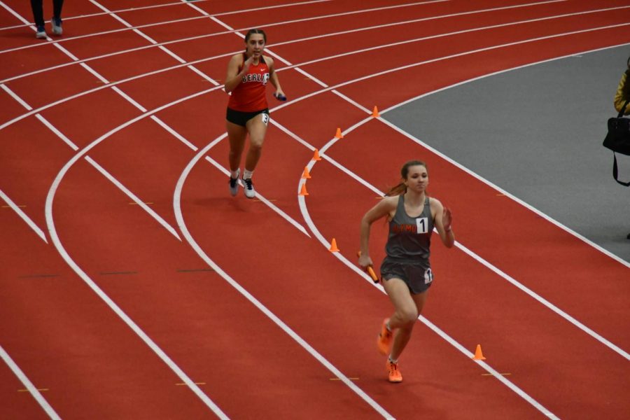 Sophomore Kate Femali races her leg of the 4x200 meter relay in an effort to catch up to Plymouth.