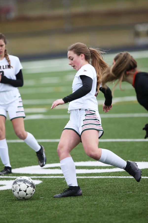 Freshman Taviah Fredenburg goes to kick the ball at the soccer game at home vs. Little Chute on April 11. 