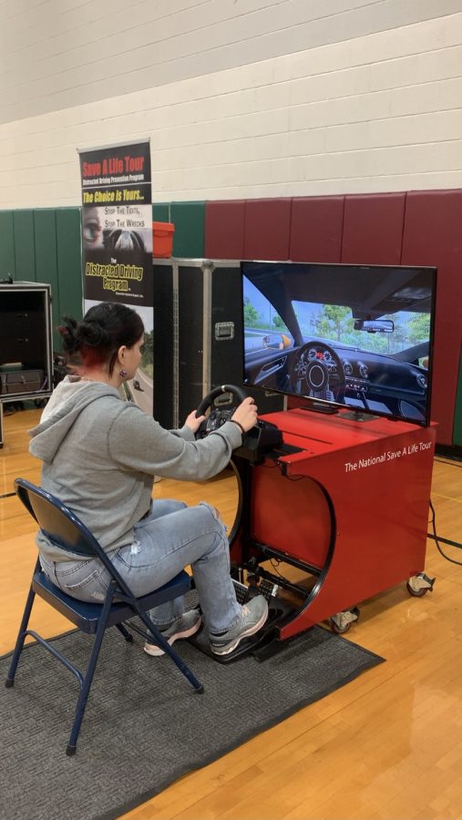 Senior Gabby Delzer tries the texting and driving simulator and discovers it is harder than she thought.