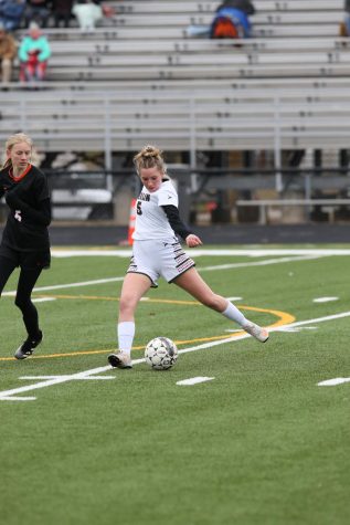 Sophomore Molly Shearer winds up for a kick in the first game against Ripon. 