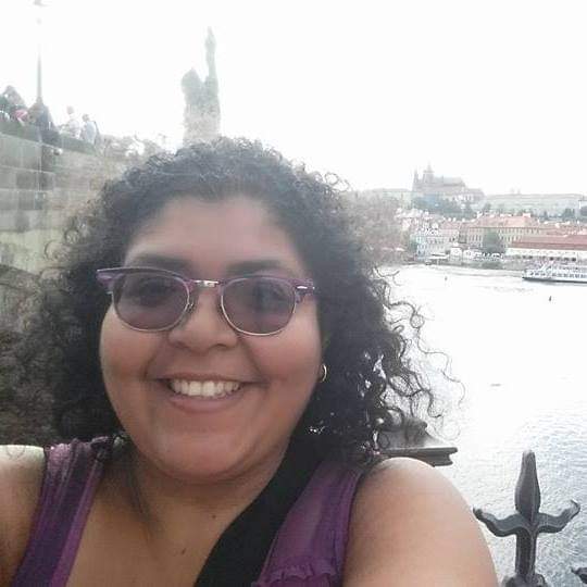 New english learner teacher, Laura Dominguez taking a photo in Prague, Czech Republic. This occurred during an 8 week backpacking trip through Europe.