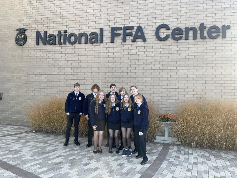 FFA members smile outside of the National FFA Center in Indianapolis. Students attended information sessions, rodeos, concerts, and were able to see new technology at the FFA National Convention. FFA stands for Future Farmers of America and is a student-led organization that is not just for students who want to be production farmers; FFA also welcomes members who aspire other careers as scientists or business owners and more, FFA Advisor Melissa Remer said. 