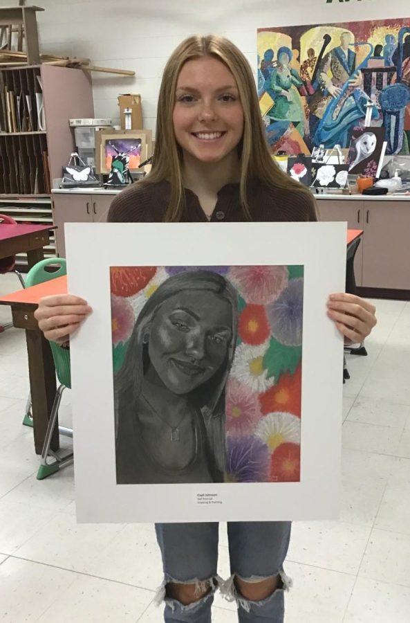Senior Cayli Johnson shows off her work that was recognized  at the regional level for Youth Art Month.