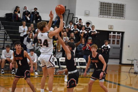 Junior Brock Wilde goes up for a shot against Wautoma. The boys won 73-60. “Knowing that we have the ability to beat good teams motivates us,” Wilde said.