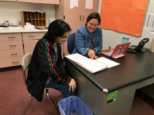 Paraprofessionals at the school provide additional help to students that are in need of assistance. Paraprofessional Natosha Franke helps teach material to sophomore David Fuentes during a seventh hour resource. 
