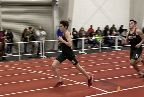 Freshman Thomas McCarthy runs the 1600 at the meet on March 16 at Ripon College. McCarthy placed first in the race. 