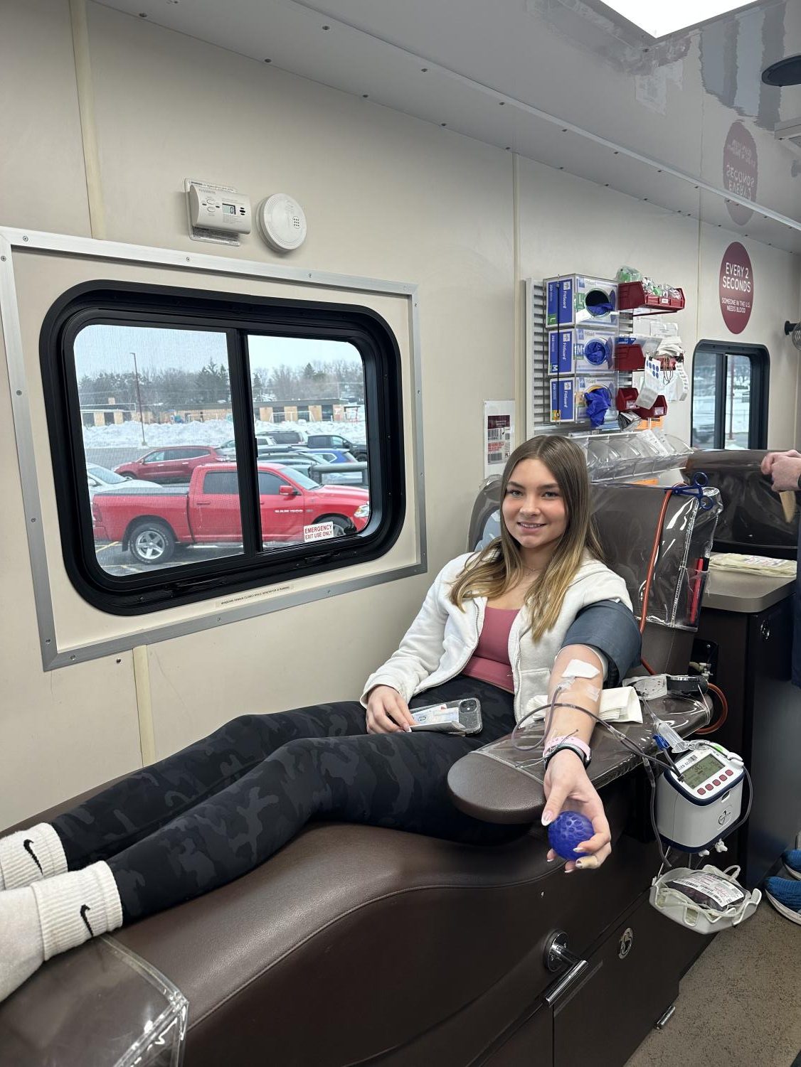 Junior Allie Thull donates her blood after receiving a call from the donation center encouraging her to donate her common blood type, O positive. 