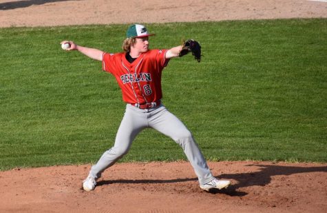 Sophomore Luke Budde pitches at home against Kewaskum. Underclassmen have been filling spots on varsity because of a lack of a JV team.