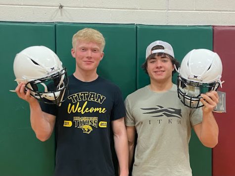 Junior Wyatt Hamersma and freshman Jakob Martin will wear these new helmets next year on the feild. These helmets, which they received through the Packers Helmet Give Back Program, are valued at $6,000. 
