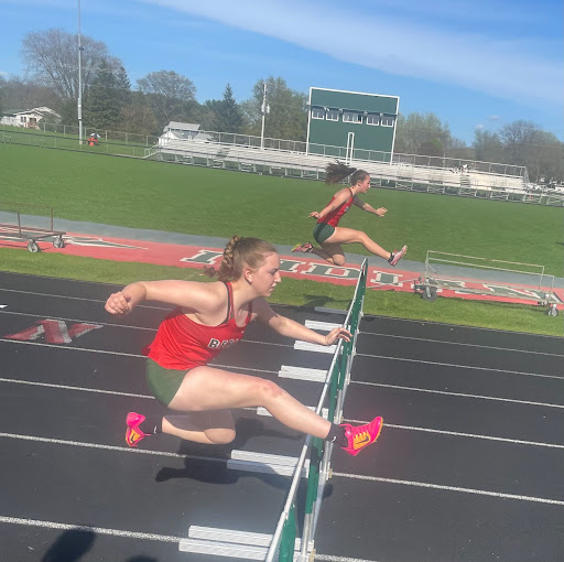 Sophomore Eva Fleegal runs the 100-meter hurdle. Eva Fleegal also ran the 300-meter hurdle at the home track meet on May 9. 