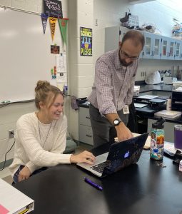 Science teacher Paul Bell (right) helps science teacher Anna Maramonte (left) go over her notes. This was during their prep period in Maramonte’s room. “Mr. Bell is helping me get adjusted to the school and the curriculum,” Maramonte said. 