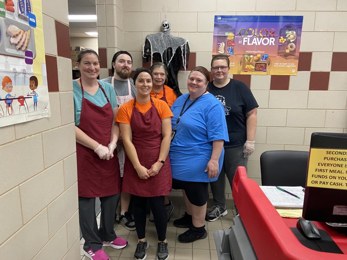 Food service staff get ready to prep for the high school lunch following clean up after the middle school lunch. This week is recognized as National School Lunch Week. 