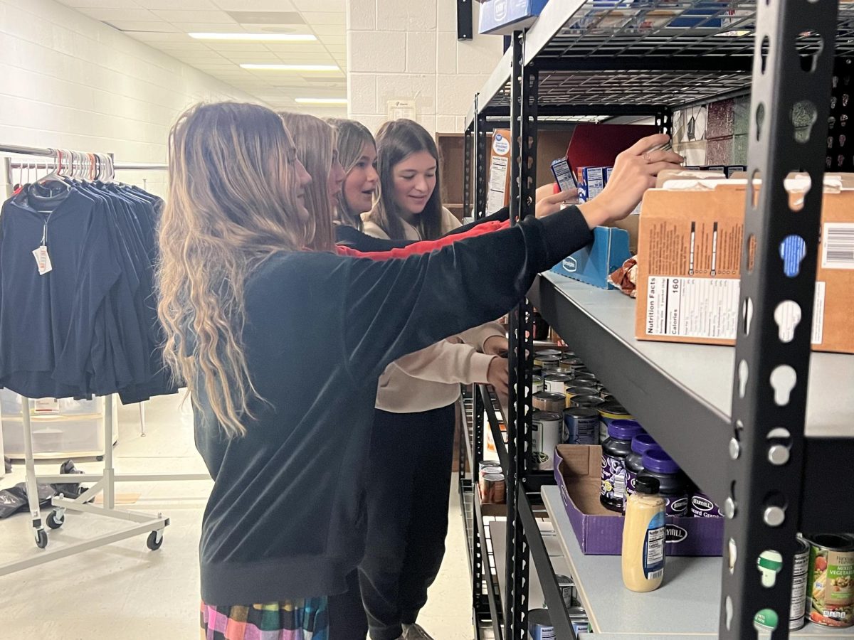 Freshmen KIND members Annika Pulvermacher, Abigail Shattuck, Kennedy Bending, and Hannah Drover spend their ELT time counting and stocking the shelves in the food pantry, which is located on the second floor on the other side of the women’s staff bathroom.