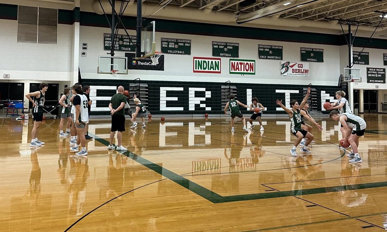 The boys basketball team practices a close out defense drill. They started practice on Monday. We plan to hit the ground running and pick up where we left off last year. I would love to see us in a position to compete for a conference championship and make a deep postseason run, Head Coach Jeremy Mercer said. 