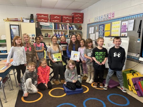 KIND Committee freshman members Katera Hartzke and Gwendolyn Bruce-DeMuri read to second grade teacher Tammy Goettl’s class on Feb. 28. 
“I can be kind by watering plants for neighbors when theyre away,” second grader Quinn Kujawa said.