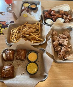 The picture above is of two everything pretzel knots, a side of French fries, and two baskets of boneless wings. One of the baskets has no sauce, while the other has half wild sauce and honey garlic. The sauces were very hot, especially the wild. This would not be something that I would get but, if you like hot food that is definitely for you. The pretzels were soft, and the fries were perfect.