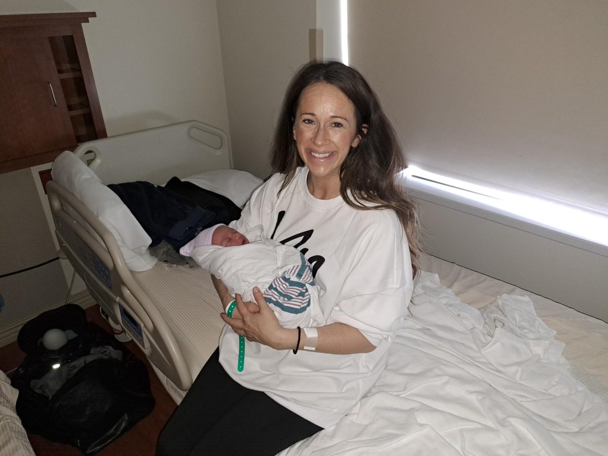 Jacqueline Schommer holds the intended family’s baby boy. “I decided last year (to become a surrogate) because I had a friend who was struggling with infertility. I wanted to help her, but she ended up getting pregnant. I realized at that moment I wanted to help another family,” Schommer said. 