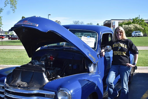 High school math teacher Angie Clark stands next to her 1949 Chevy 3600 pickup.

