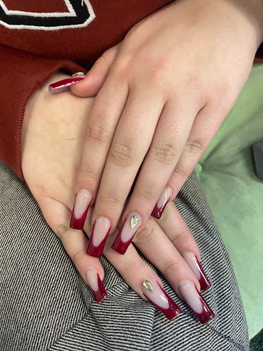 “These are this month's nails. My friend Annadora did them for me, and I really like the red with the gem,” senior JuliAnna Plantz said.