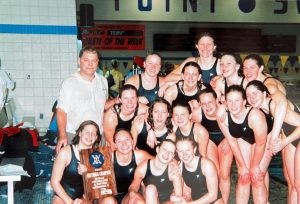 Swim Coach Phil Sass celebrates with the 2002 girls sectional champions. Susan (Harmsen) Voigt 03’, a member of the team, reflected on her improvement. “When I first started swimming I was NOT good. I was barely able to swim a full lap across the pool to make the team,” Voigt said. “His coaching was the primary reason for my success as an athlete.”
