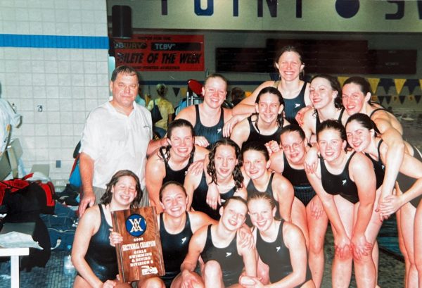 Swim Coach Phil Sass celebrates with the 2002 girls sectional champions. Susan (Harmsen) Voigt 03’, a member of the team, reflected on her improvement. “When I first started swimming I was NOT good. I was barely able to swim a full lap across the pool to make the team,” Voigt said. “His coaching was the primary reason for my success as an athlete.”
