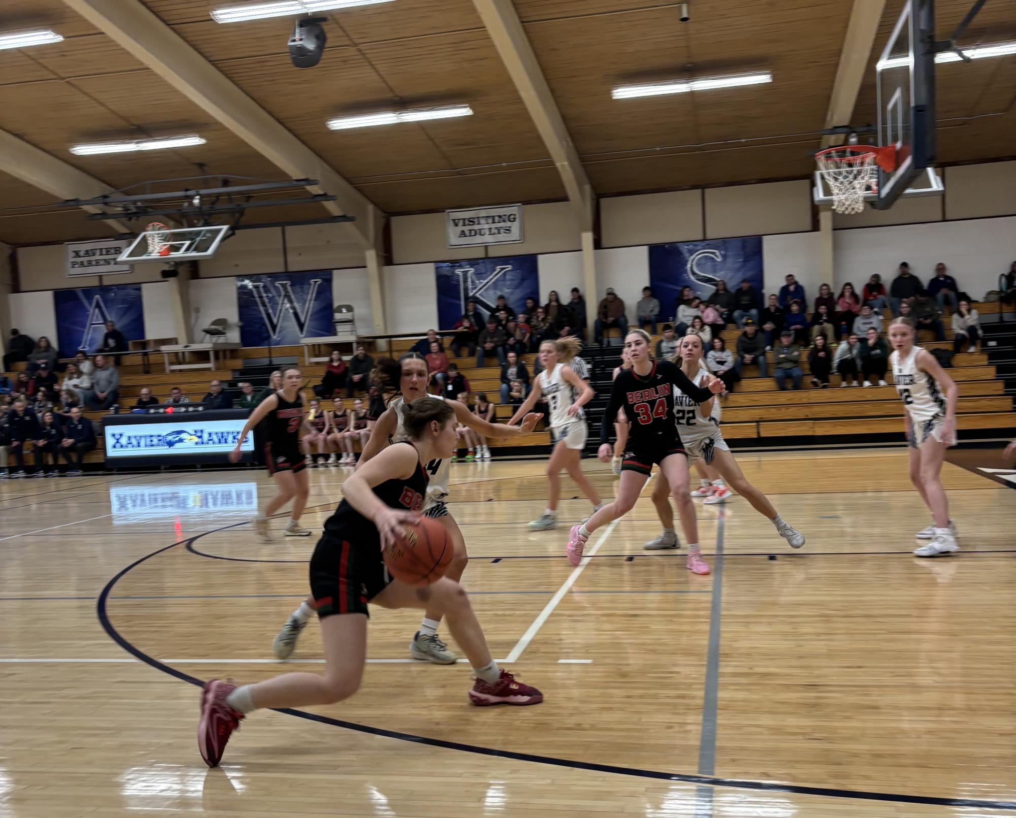 Guard Lakelyn Sobieski takes a retreat dribble, looking to pass into senior guard Callie Kurczek. “We have some smart, athletic, dedicated young women returning, so the future looks bright,” Head Coach Lisa Kurczek said.