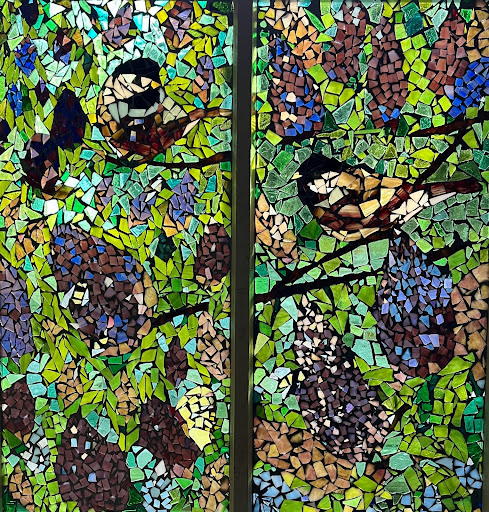 Art teacher Lori Rademann’s lilac bush mosaic was inspired by the shrub in her own backyard. It now hangs in her window. 