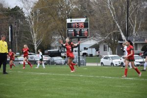 Senior Callie Kurczek goes in for a high-five after sophomore Aubrie Hilgart scores and makes the first goal during their home game May 2 against Adams-Friendship’s Green Devils. The Indians defeated the Green Devils 4-3.