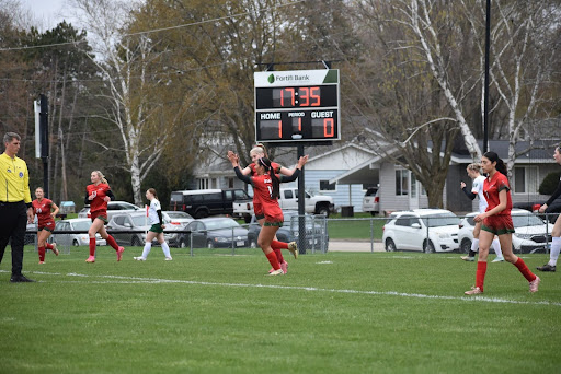 Senior Callie Kurczek goes in for a high-five after sophomore Aubrie Hilgart scores and makes the first goal during their home game May 2 against Adams-Friendship’s Green Devils. The Indians defeated the Green Devils 4-3.