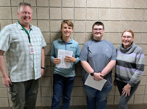 Wordsmiths adviser Andrew Reise (Left), participants freshman Ewan Steffen and sophomore Patrick Brown, and art teacher Lori Rademann (Right). Reise and Rademann were two of the three judges for the contest submissions. 
