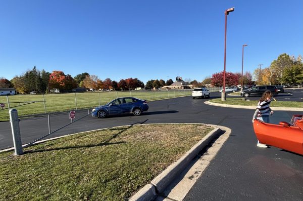 Students head home after school through the newly opened gate. “Students will be able to exit the lot quicker with two exits versus one. Hopefully, there is a shorter line to leave and fewer cars blocking parents from entering our pick-up lot, ” Principal Bryant Bednarek said.