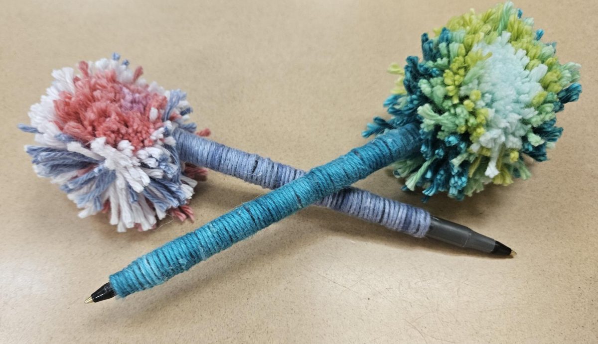 In the newly installed Sewing class, students make pom pom pens for their fibers unit. “Sewing is also a skill that can lead to career opportunities, such as in the fashion industry,” Family and Consumer Science teacher Whitney Keyes said.