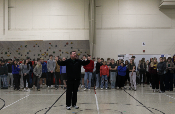 Principal Bryant Bednarek directs high school students to the doors they may exit from after the annual safety drill walk to Clay Lamerton’s little gym on Oct. 30. Science teacher Ben Sanderfoot has been the high school representative of the District Safety Committee since its creation in 2017. “I appreciate that our school district places a high priority on keeping everybody safe,” Sanderfoot said.