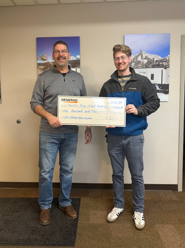  Jerry Bartal Generac’s facilities manager (left) presents Guss Hechter Robotics Club adviser (right) a $1,000 check to use for Robotics Club needs.  