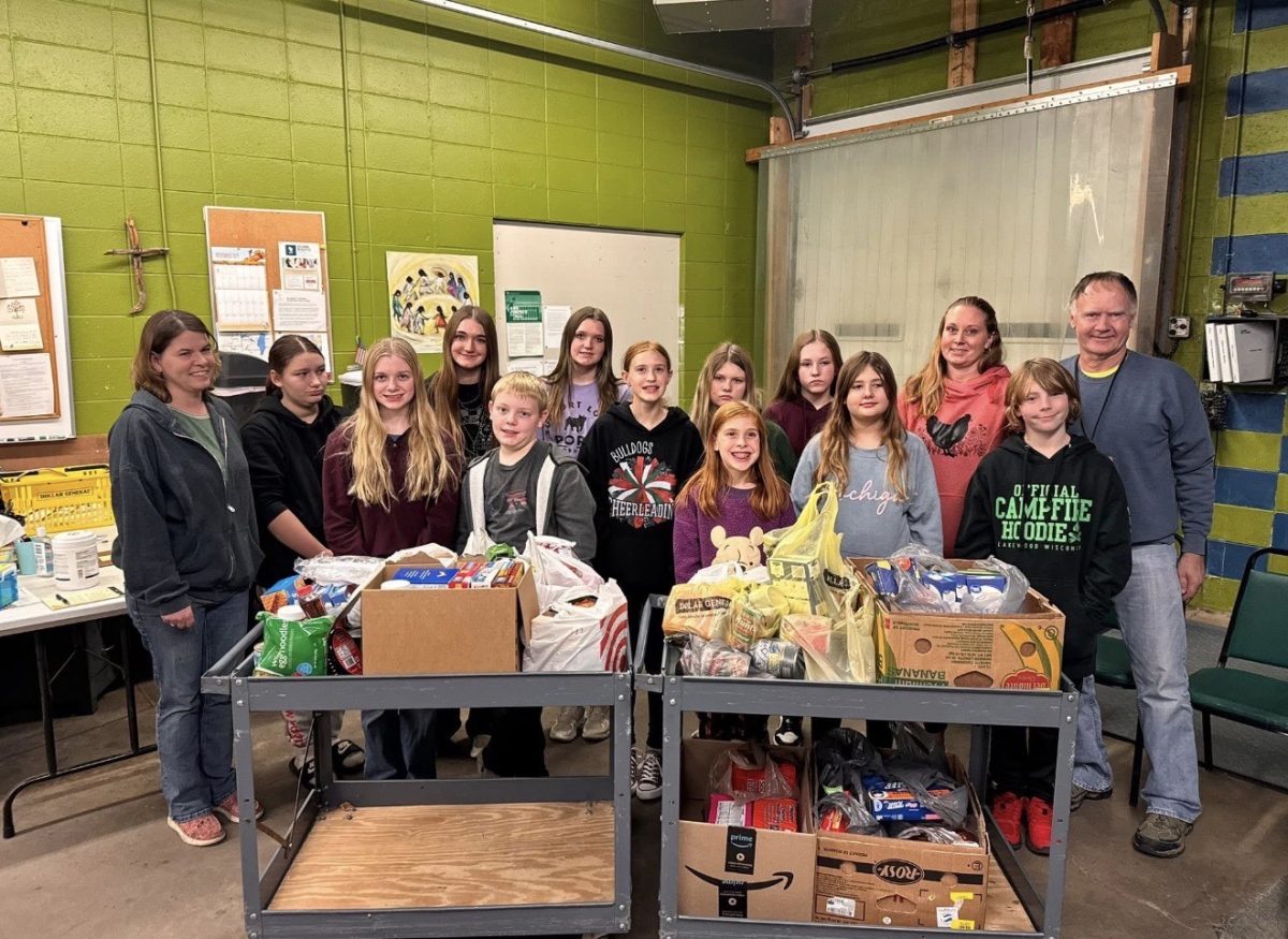 One of Berlin’s 4-H groups, Rising Clovers 4-H with food donations. 4-H regularly hosts fundraisers, group activities and community service events. “It helps students to get out of their comfort zone, and try new things,” Zeitlow said.