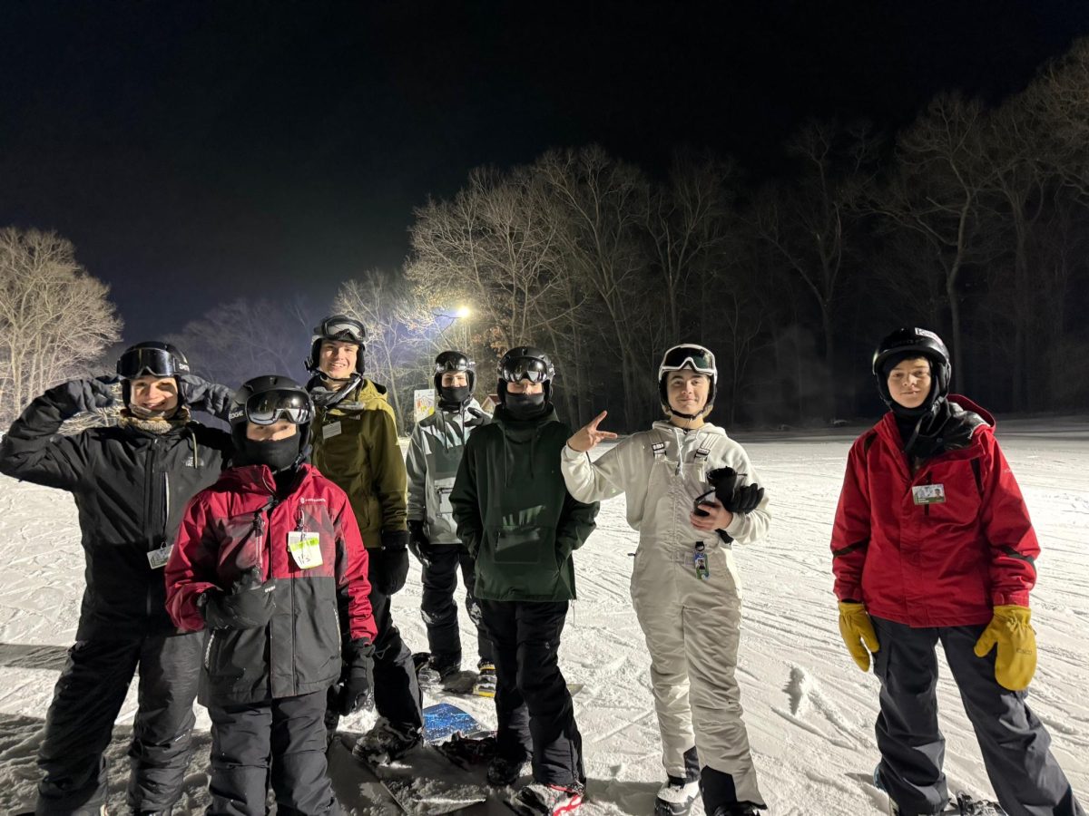 From left to right, sophomore Marshall Hess, Conner Mehn, sophomore Ewan Steffen, sophomore Marshall Mehn, freshman Kashton Mehn, sophomore Braden Costello, and freshman Aaron Schliepp at Nordic Mountain. Ski club took a bus for the trip on January 5. “I chose to snowboard because one of my friends forced me to do it, and it turns out it's pretty fun when you get the hang of it,” freshman Owen Petraszack said.
