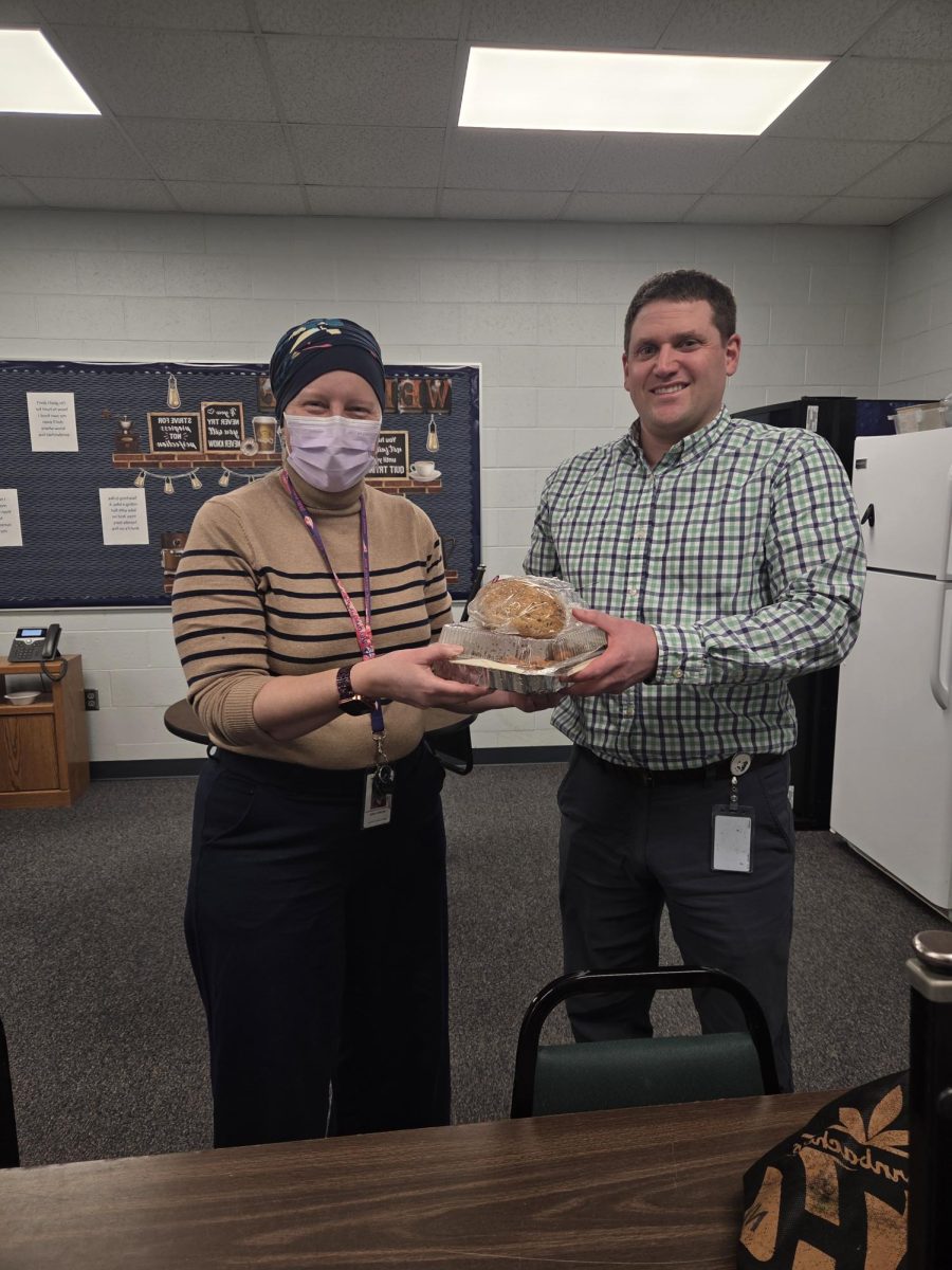 Chemistry teacher Nick Kvam participates in school-wide meal train. Teachers are able to sign up in Student Services, deducting the hassle of cooking from Leahy’s responsibility list. “There are at least two meals a week that are made for her,” science teacher Ben Sanderfoot said.